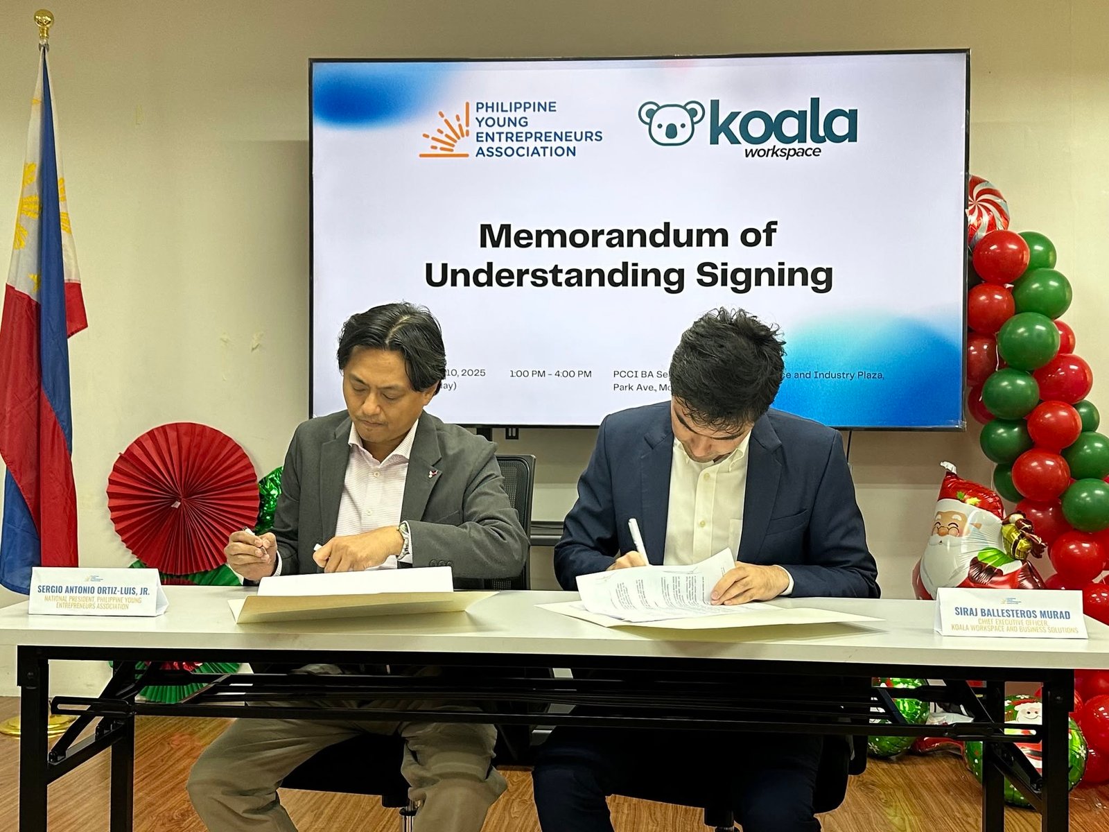 Koala Workspace and PYEA representatives signing their partnership memorandum